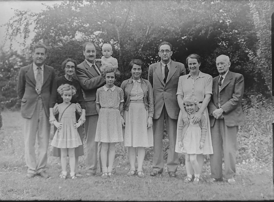 A black and white photograph of a large family gathered outdoors