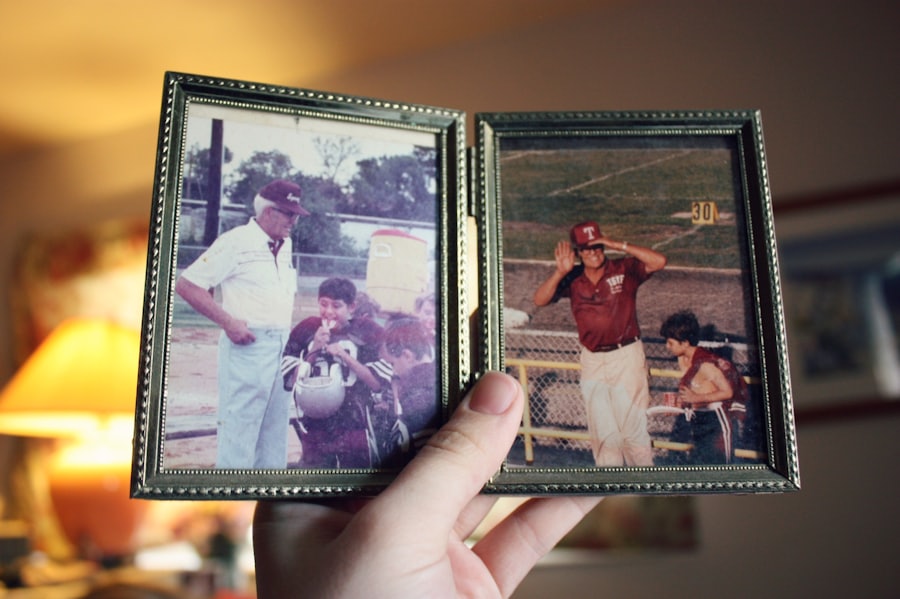 A hand holding a small frame of treasured family photos